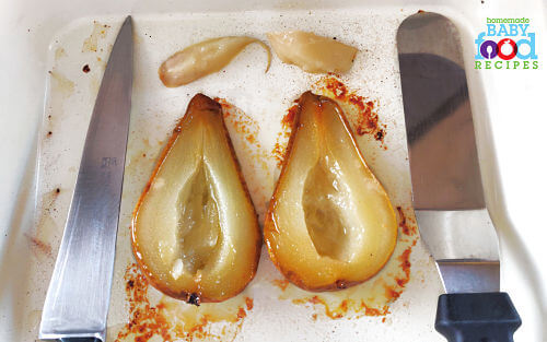 A baked pear with the core removed