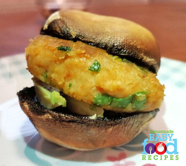 A chickpea patty in a roasted mushroom bun - a fun finger food for baby