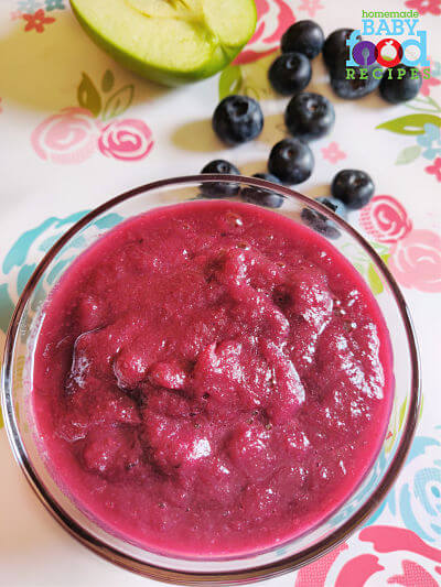 A bowl of blueberry and apple baby food puree