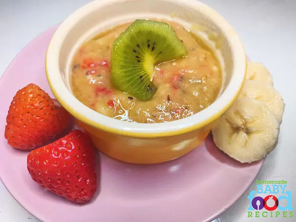 A bowl of Kiwi and Strawberry Puree with banana for baby